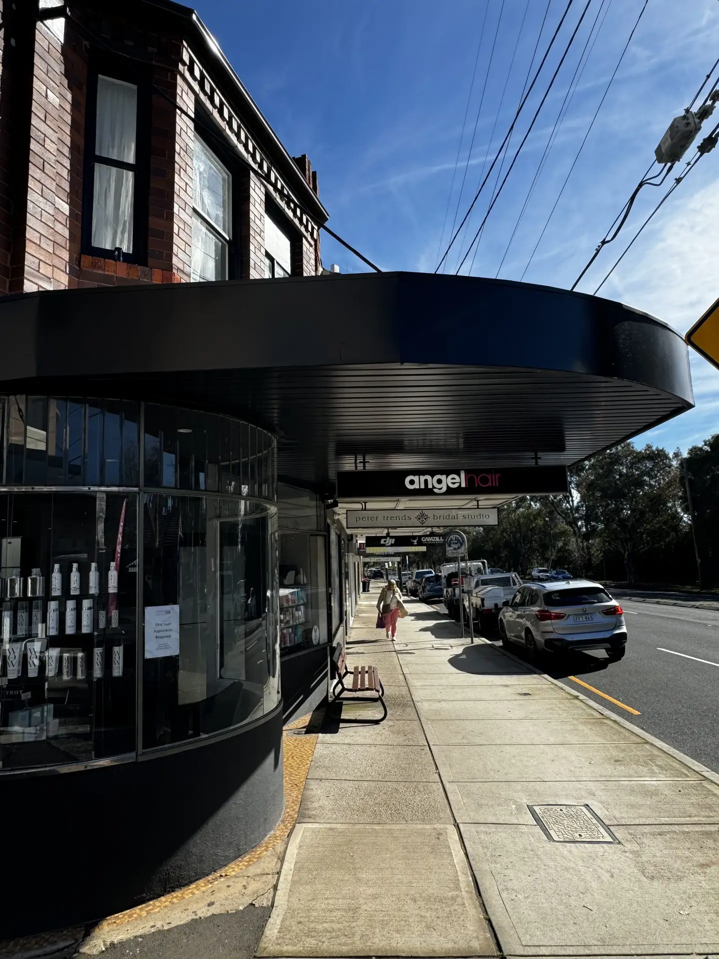 Recently repaired shopfront awning in Roseville, Sydney, providing shade over the glass frontage