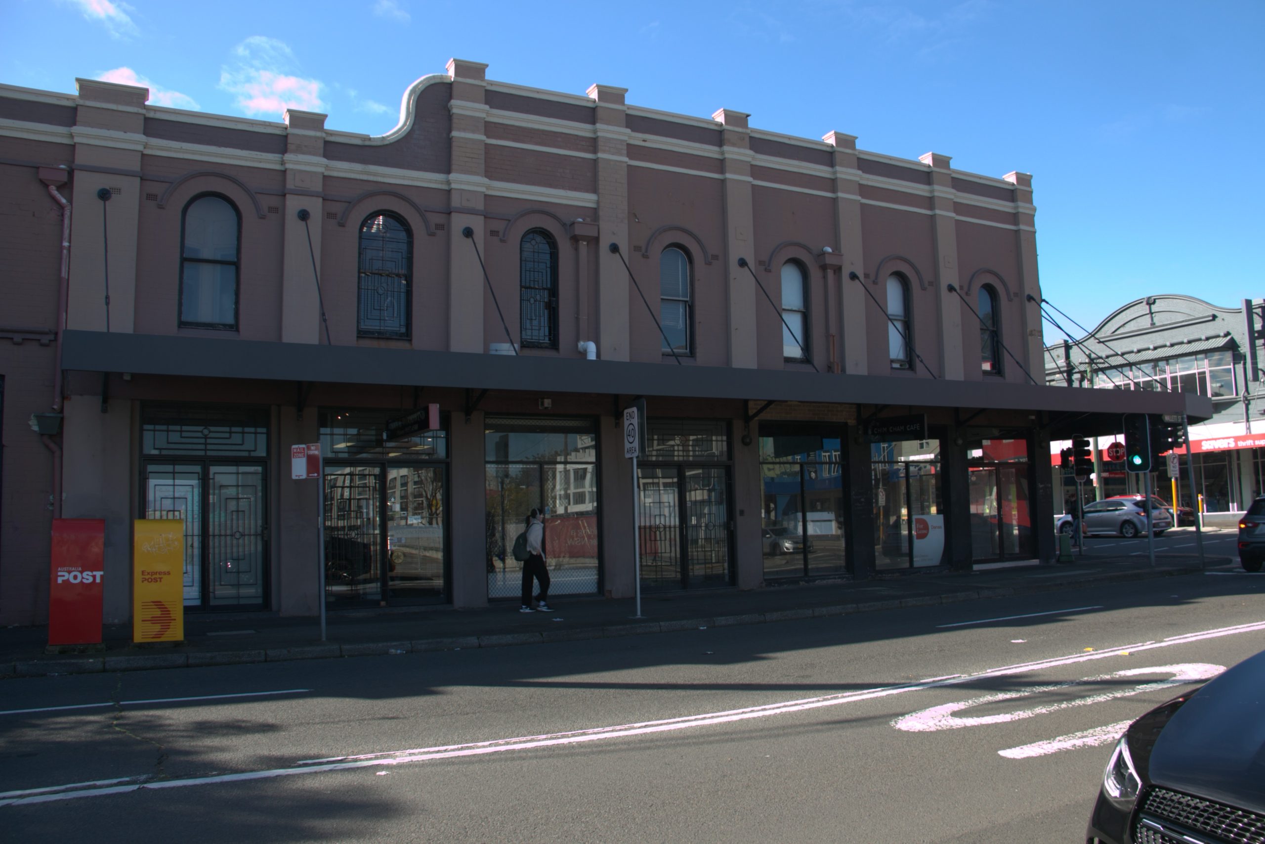 Long canopy awning spanning a row of heritage shopfronts in Camperdown
