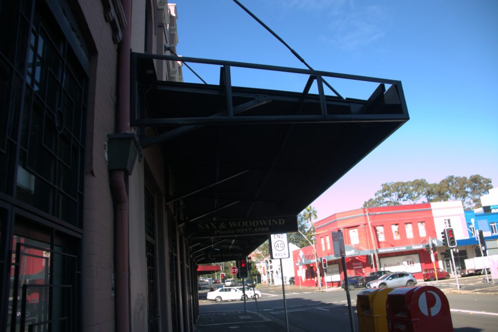 Underside view of the steel-framed awning showing structural bracing in Camperdown