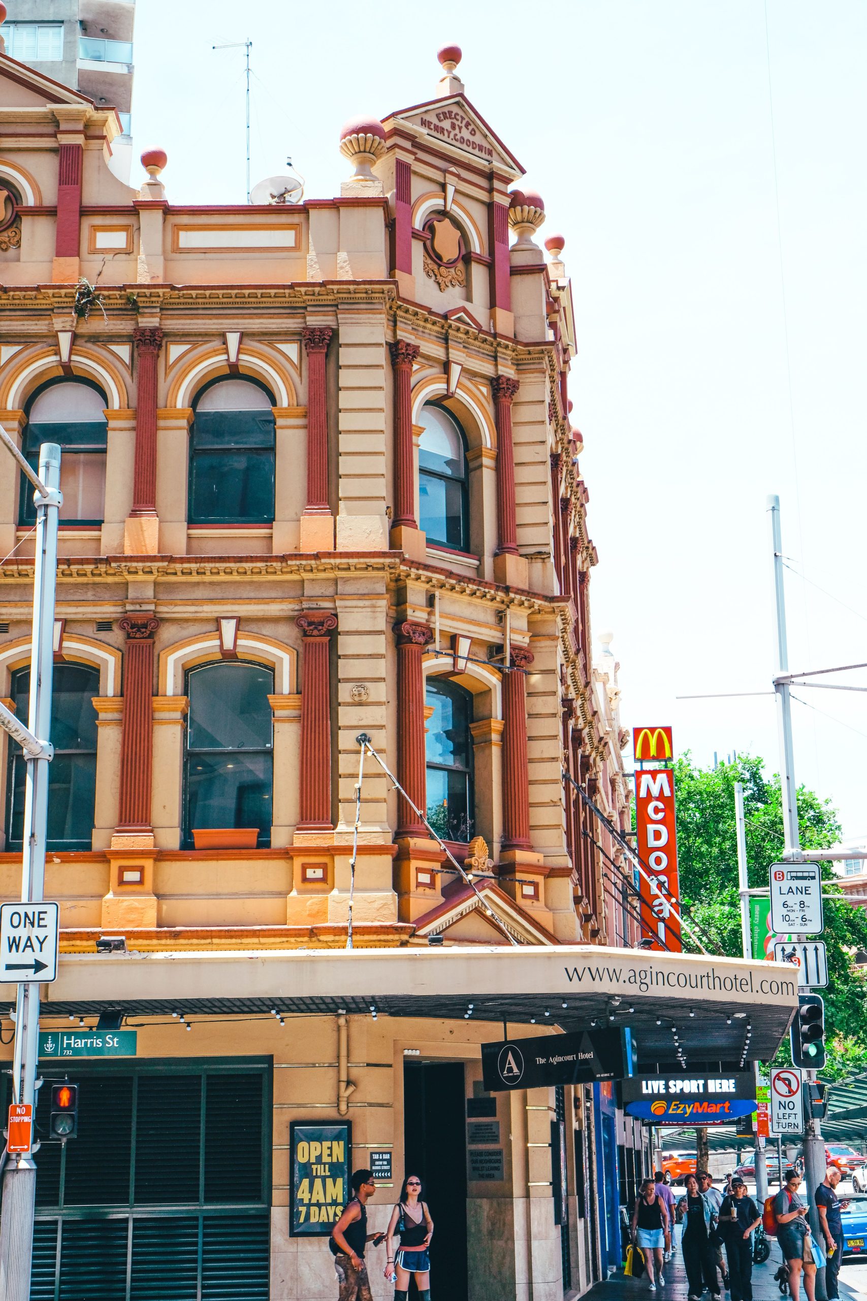 Ornate heritage corner building with an awning over street-level shopfronts