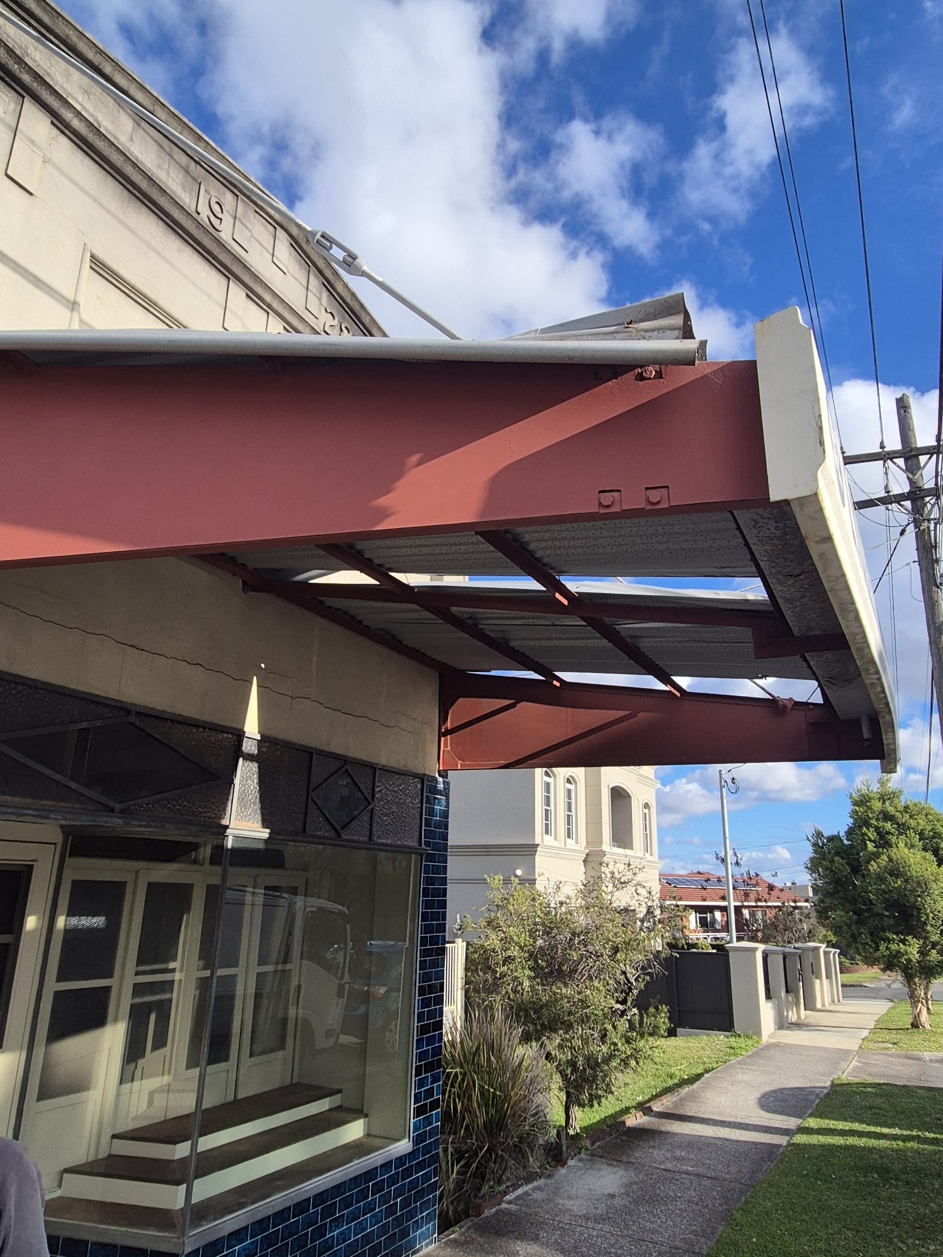 Exposed steel cantilever framing on a heritage shopfront awning in Chiswick, Sydney
