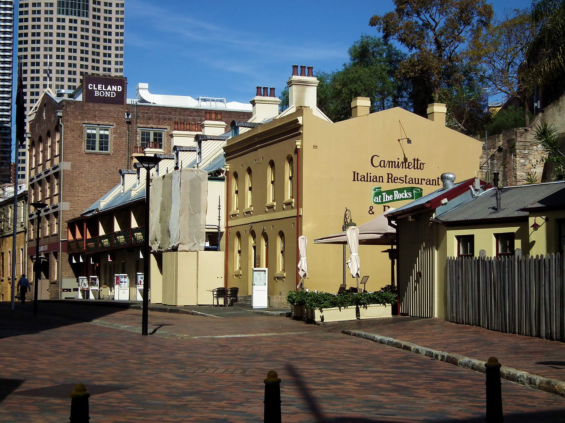 Heritage sandstone shopfront and restaurant signage on Playfair Street in The Rocks, Sydney