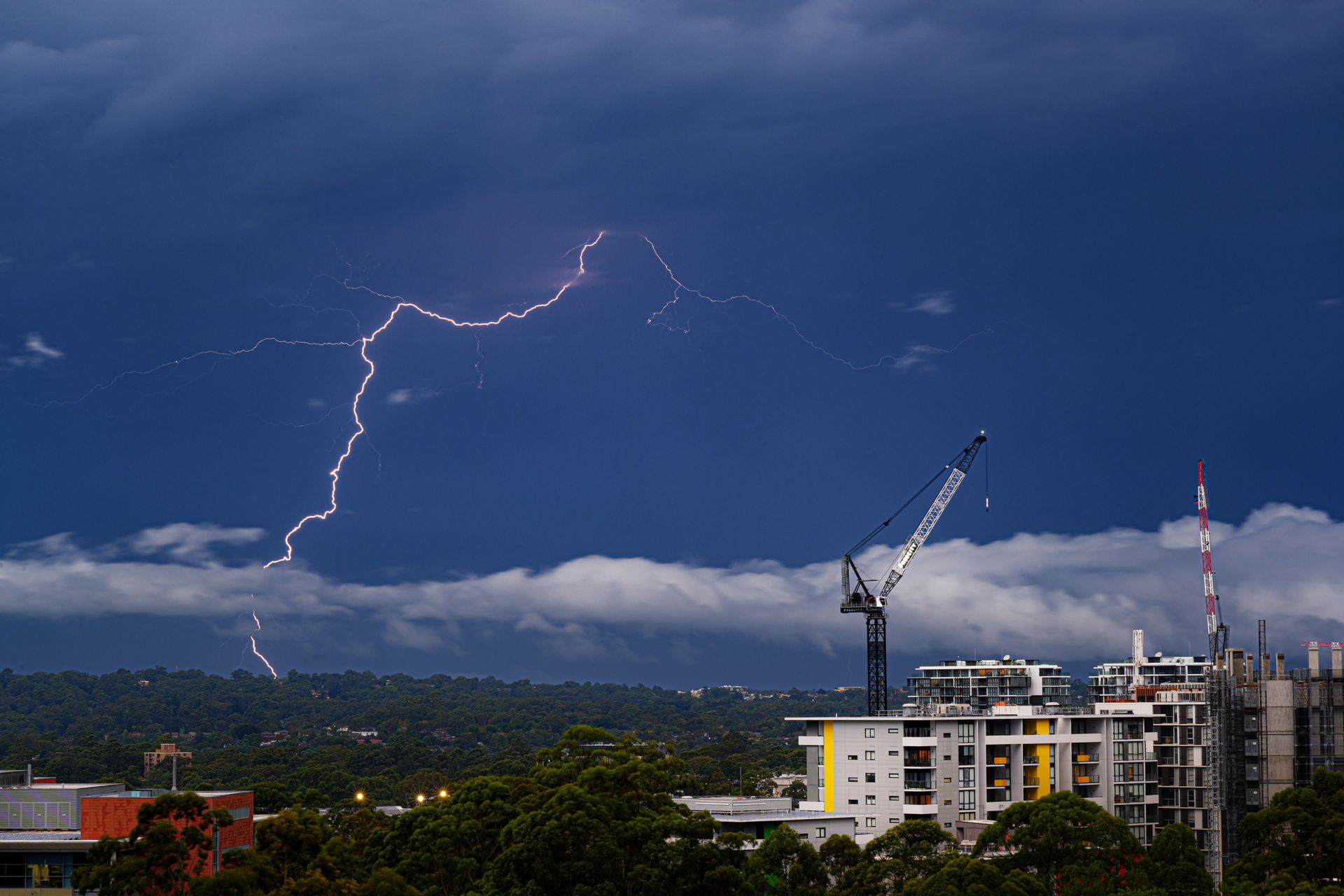Lightning storm over a Sydney construction site during storm season