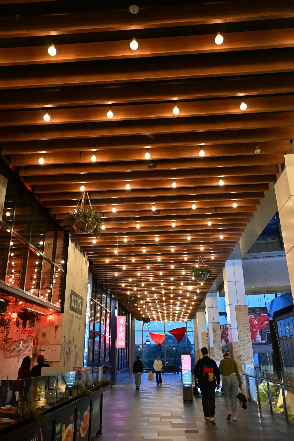Timber-slatted architectural canopy over a covered pedestrian dining laneway in Chatswood