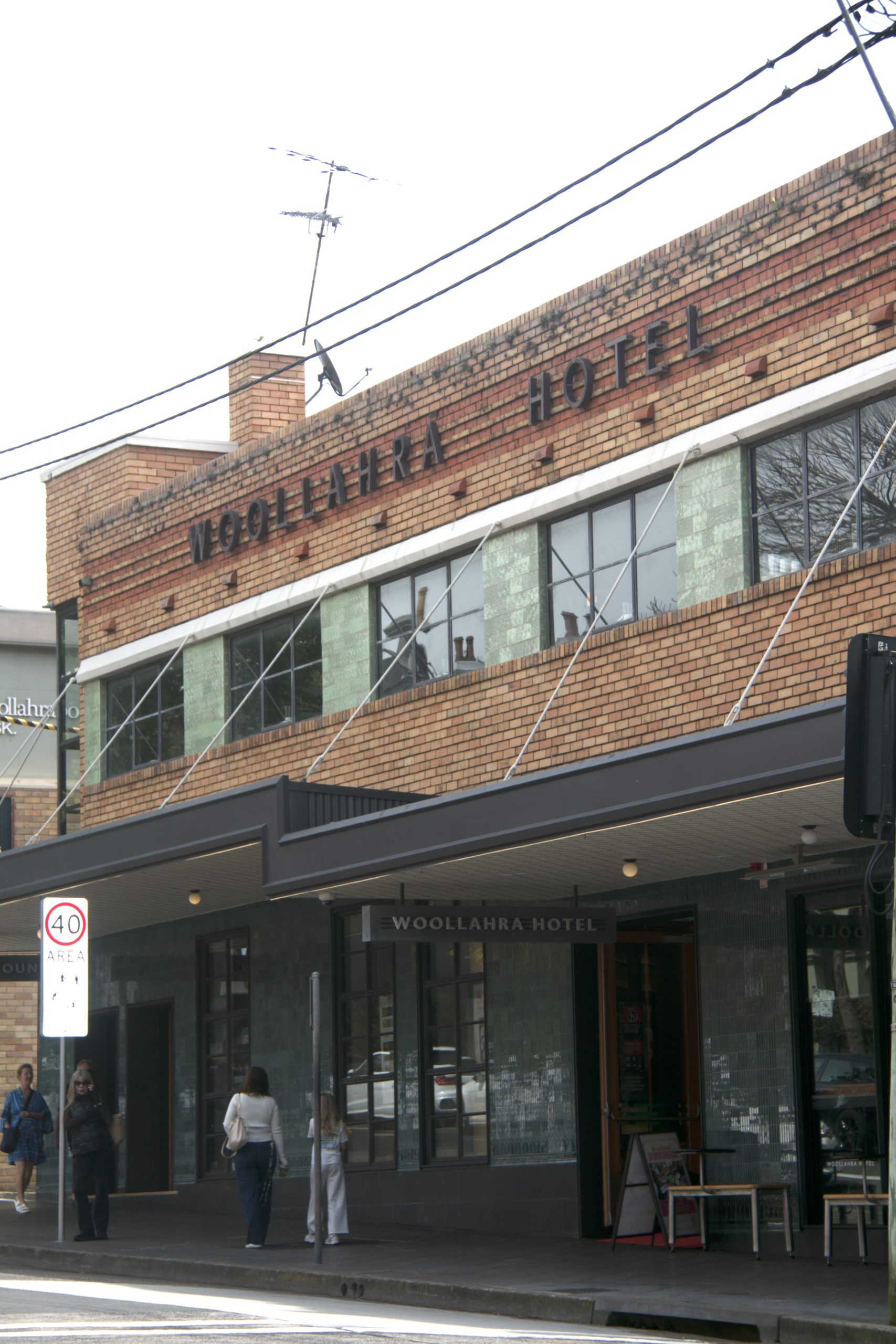Tie rods supporting the street awning on the Woollahra Hotel, a heritage corner pub in Sydney